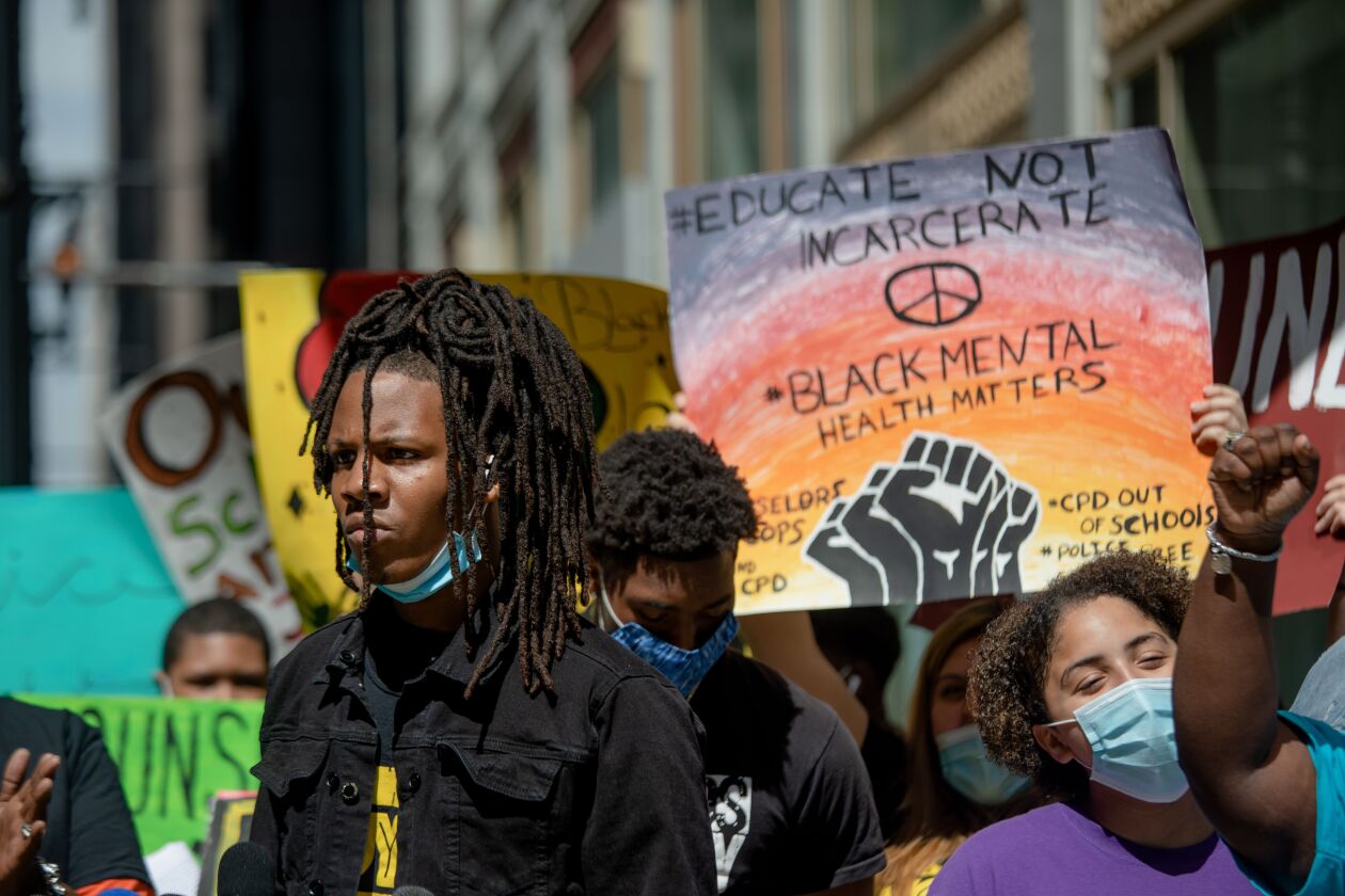 Caleb Reed, a youth activist and a junior at Mather HIgh School, joins a protest demanding the removal of School Resource Officers